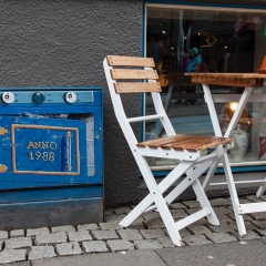 Artists paint the electrical boxes outside many businesses