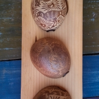 The carving on the gourds used for the mezcal tasting.